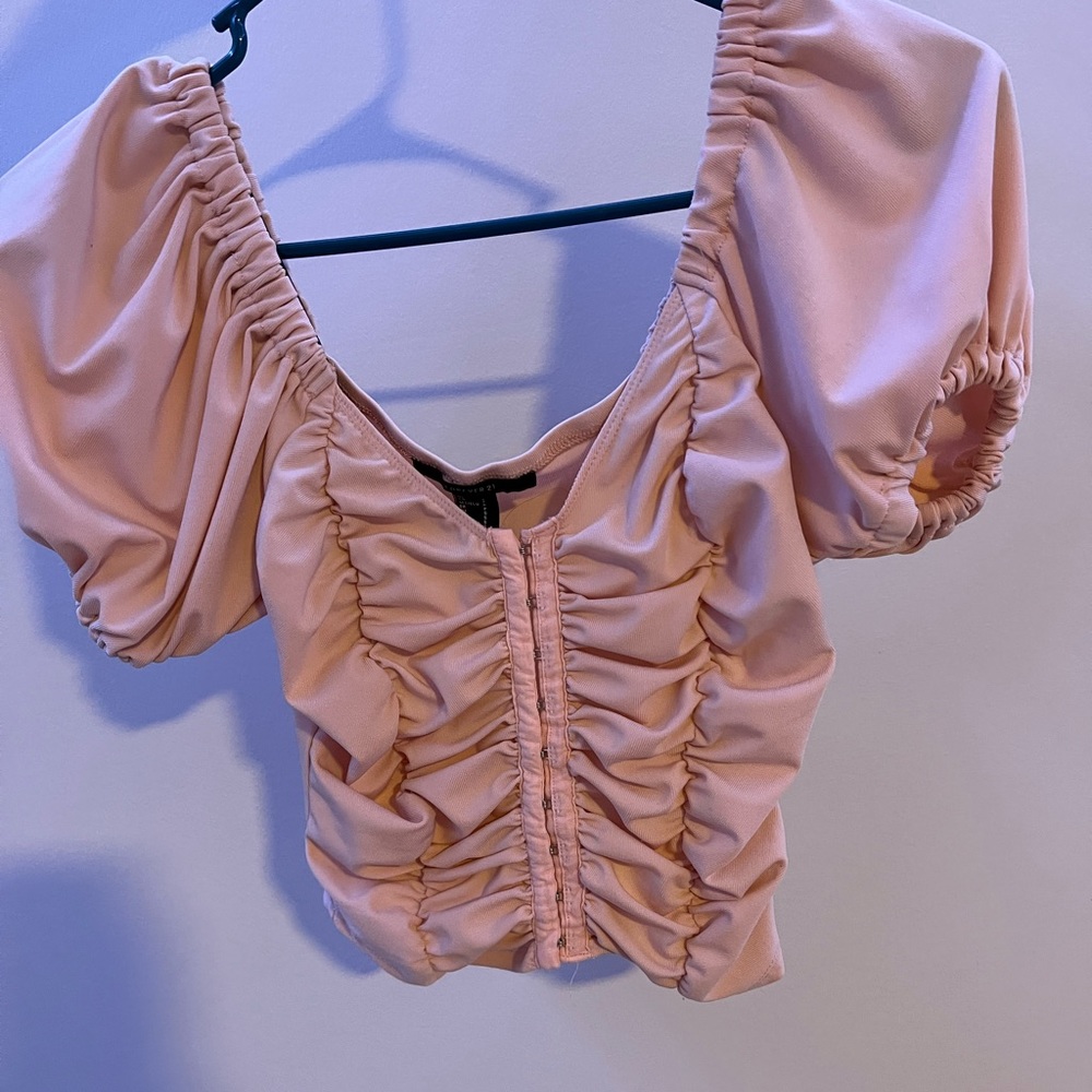 This is a pink blouse from forever 21 in a size S